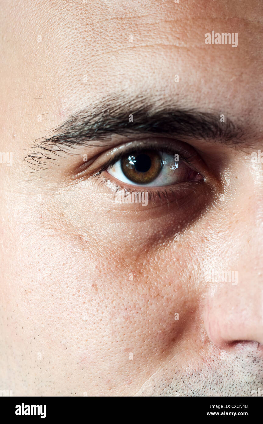 Brown color male eye, close up image. Stock Photo