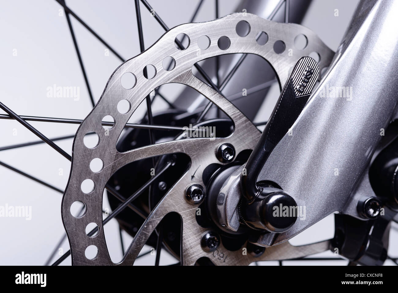 Close up detail of the front brake discs on a bicycle Stock Photo