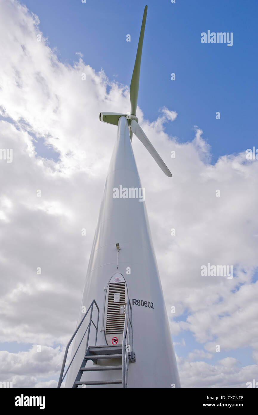 Close-up of giant white wind turbine tower & rotors against blue sky & clouds - Knabs Ridge onshore wind farm near Harrogate, North Yorkshire, England Stock Photo