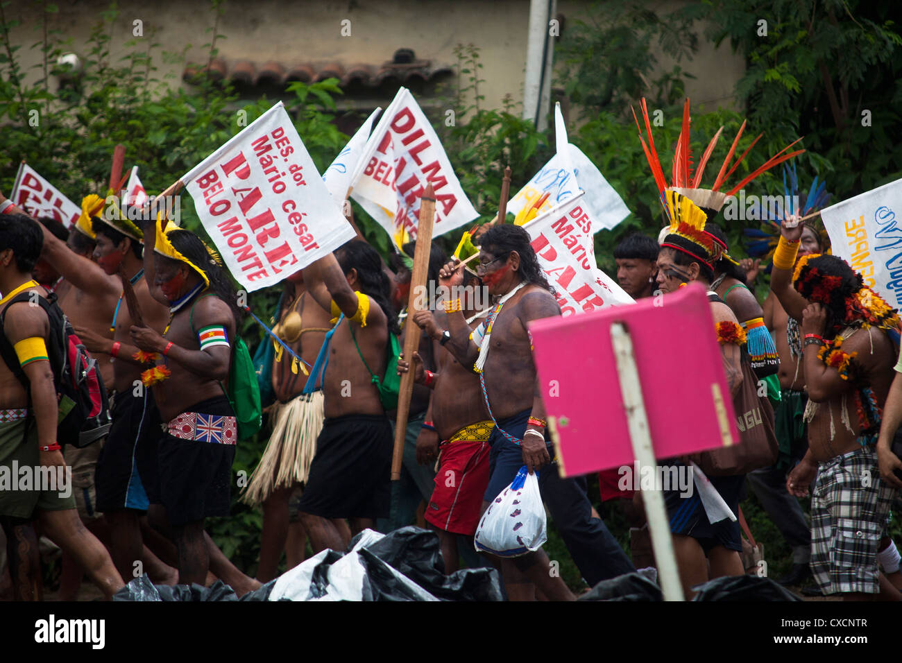 Indigenous People carry banners with the inscription, 'Stop Belo Monte Dam' demonstration at Rio+20 Rio de Janeiro Brazil Stock Photo