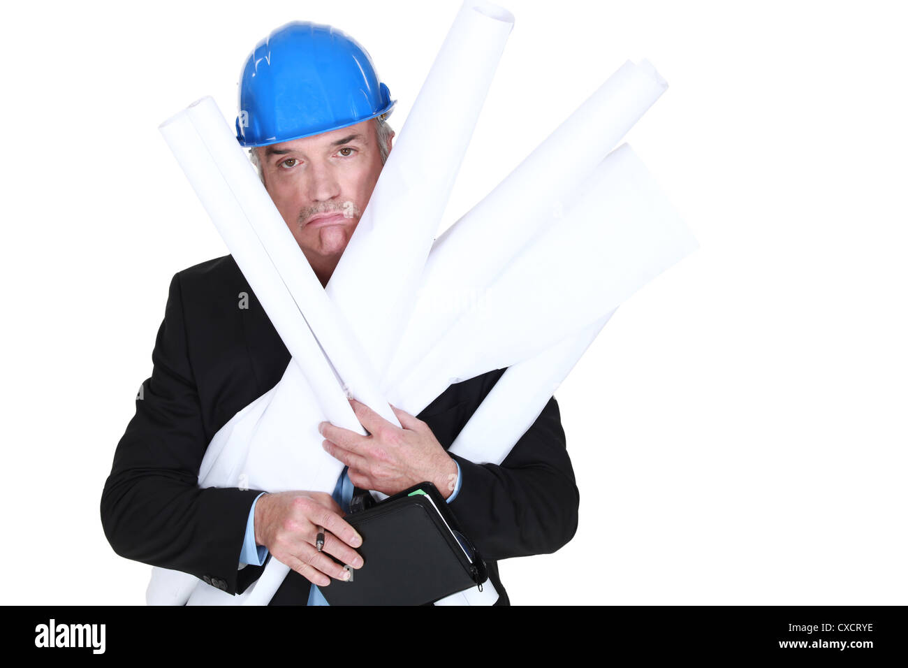 Pouting engineer carrying a stack of rolled-up drawings Stock Photo - Alamy