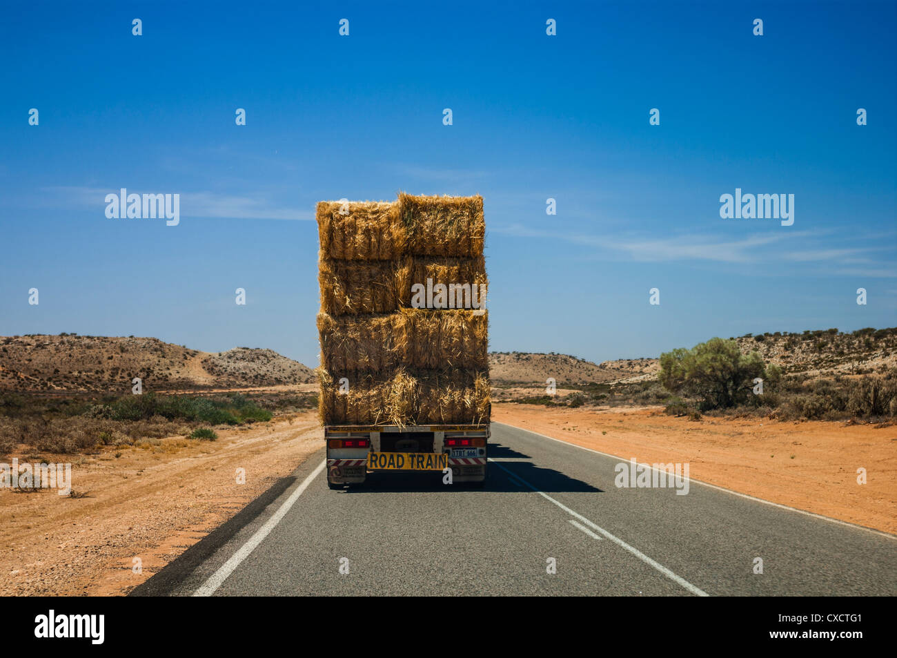 Road train carrying hay on the North-West Coastal Highway, near the Wooramel roadhouse. Stock Photo