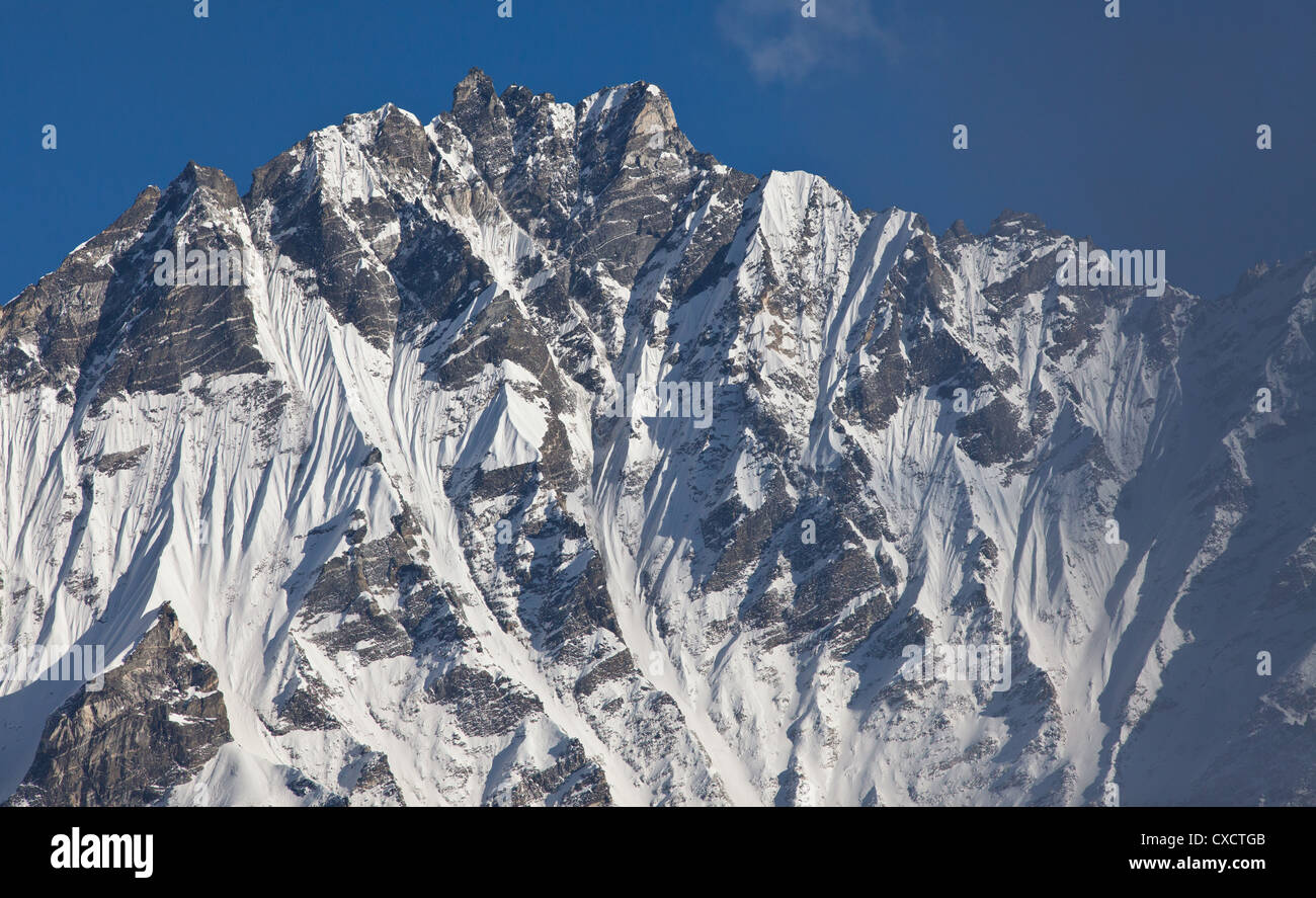 Snowcapped mountain covered with snow and ice along the Langtang Valley, Nepal Stock Photo