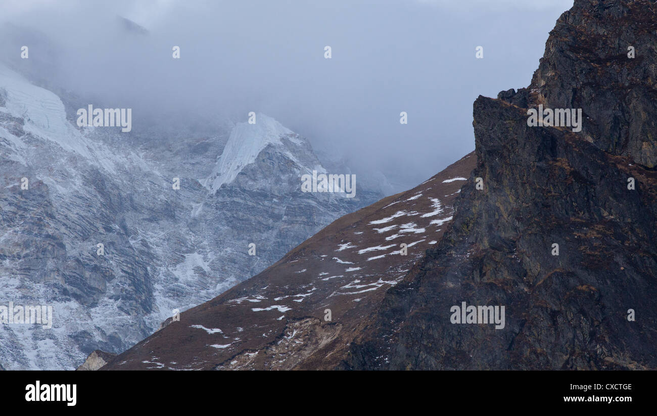 Cloud sweeping through a mountain valley along the Langtang Valley ...