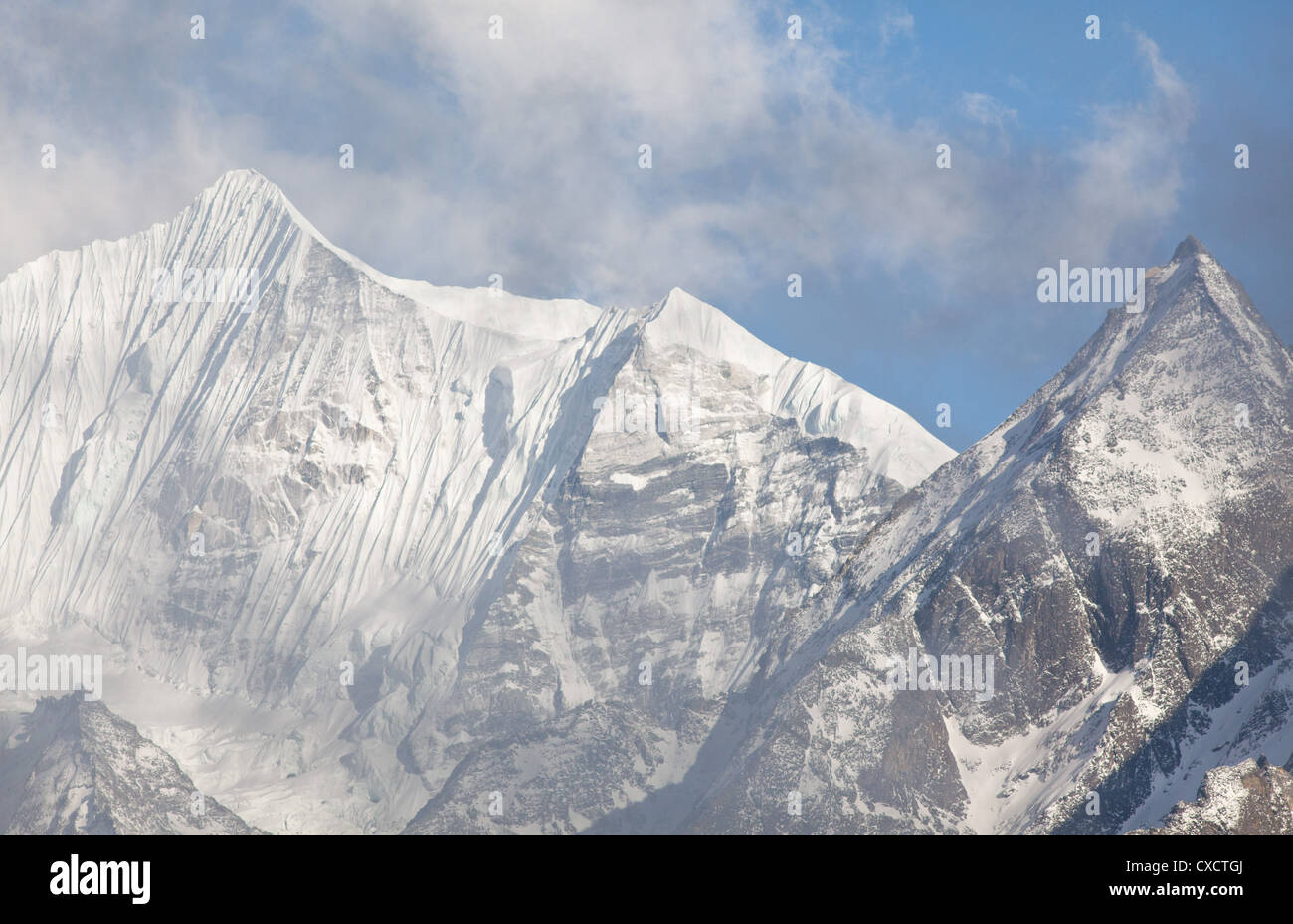 Snowcapped mountain covered with snow and ice along the Langtang Valley ...