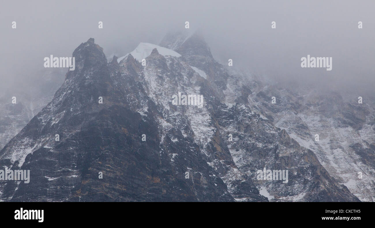 Cloud sweeping through a mountain valley along the Langtang Valley ...