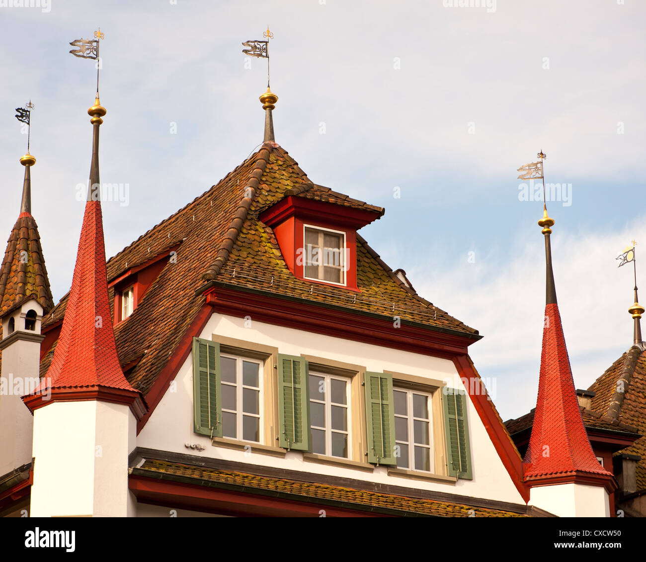 Wind vanes atop a canal house in Lucerne Stock Photo