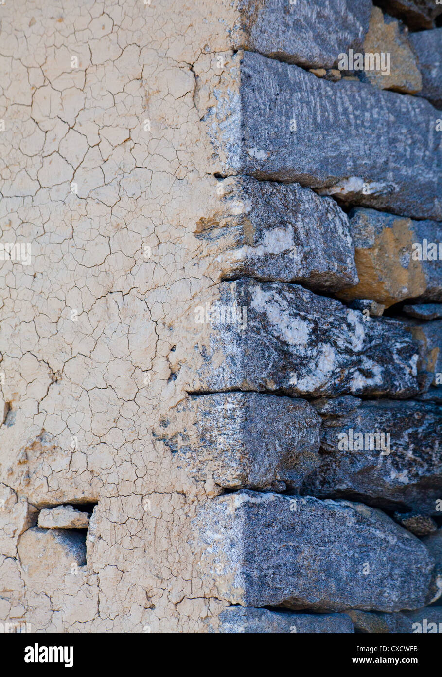 Mud rendering on an old stone building, Nepal Stock Photo