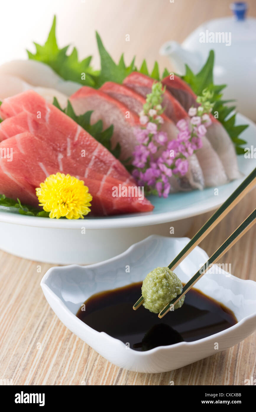 Picking Wasabi with Chopsticks Stock Photo