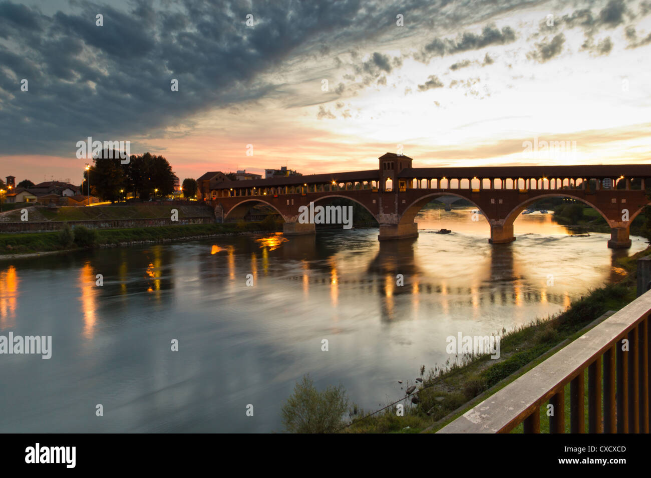 Sunset over the old bridge (Pavia - Italy) Stock Photo