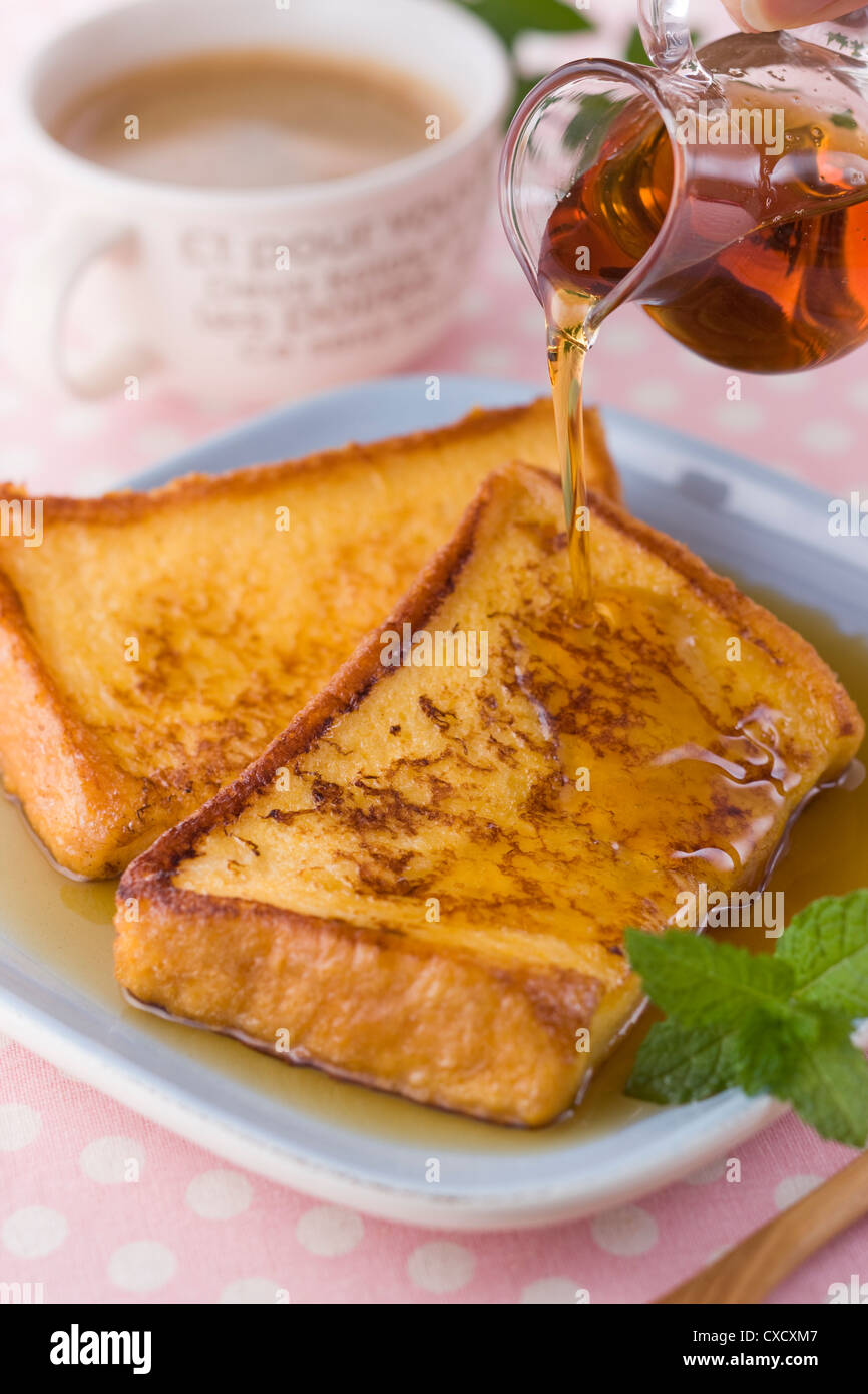Pouring Maple Syrup on French Toast Stock Photo