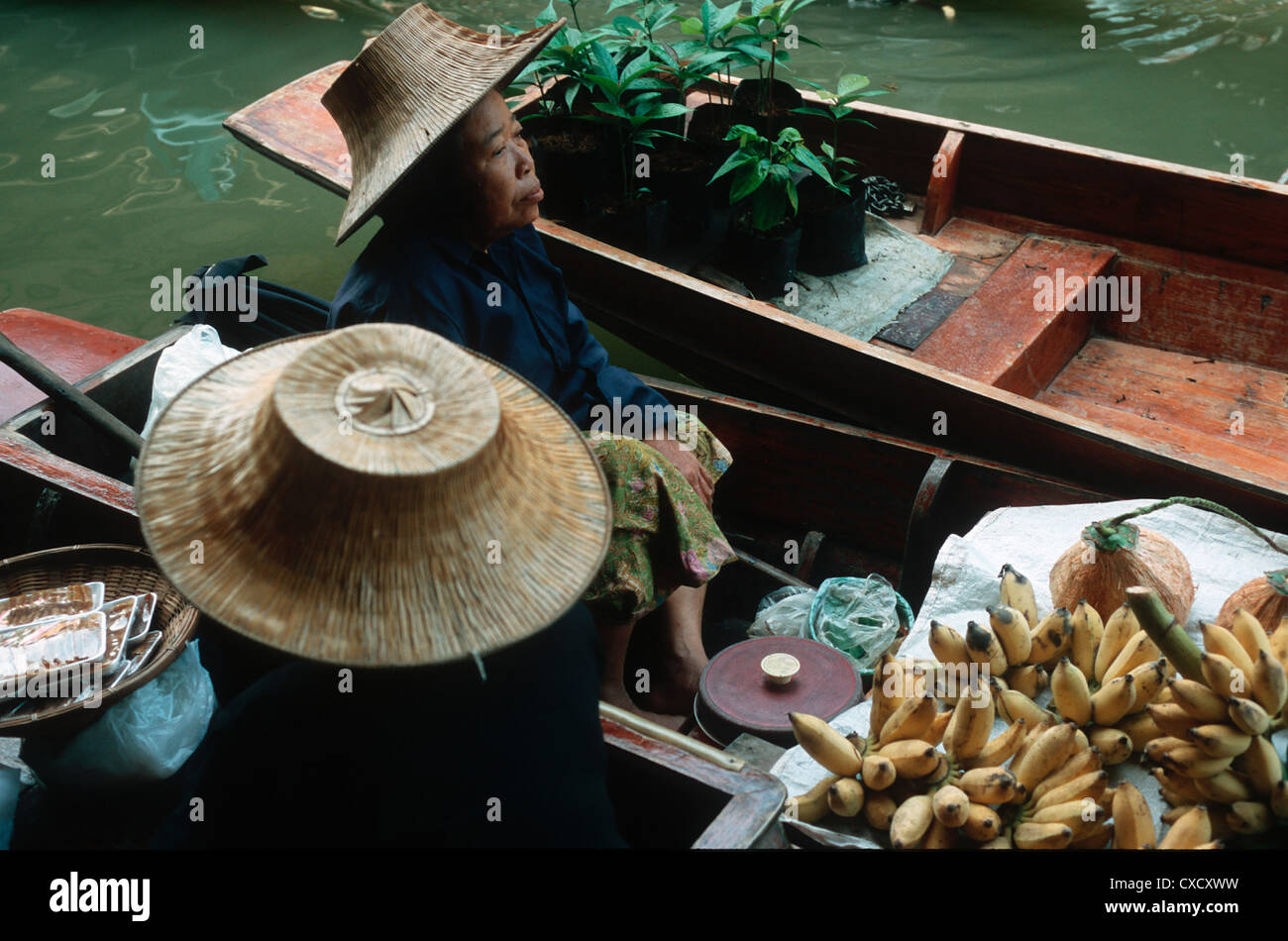 Bangkok, women sit in boats Stock Photo