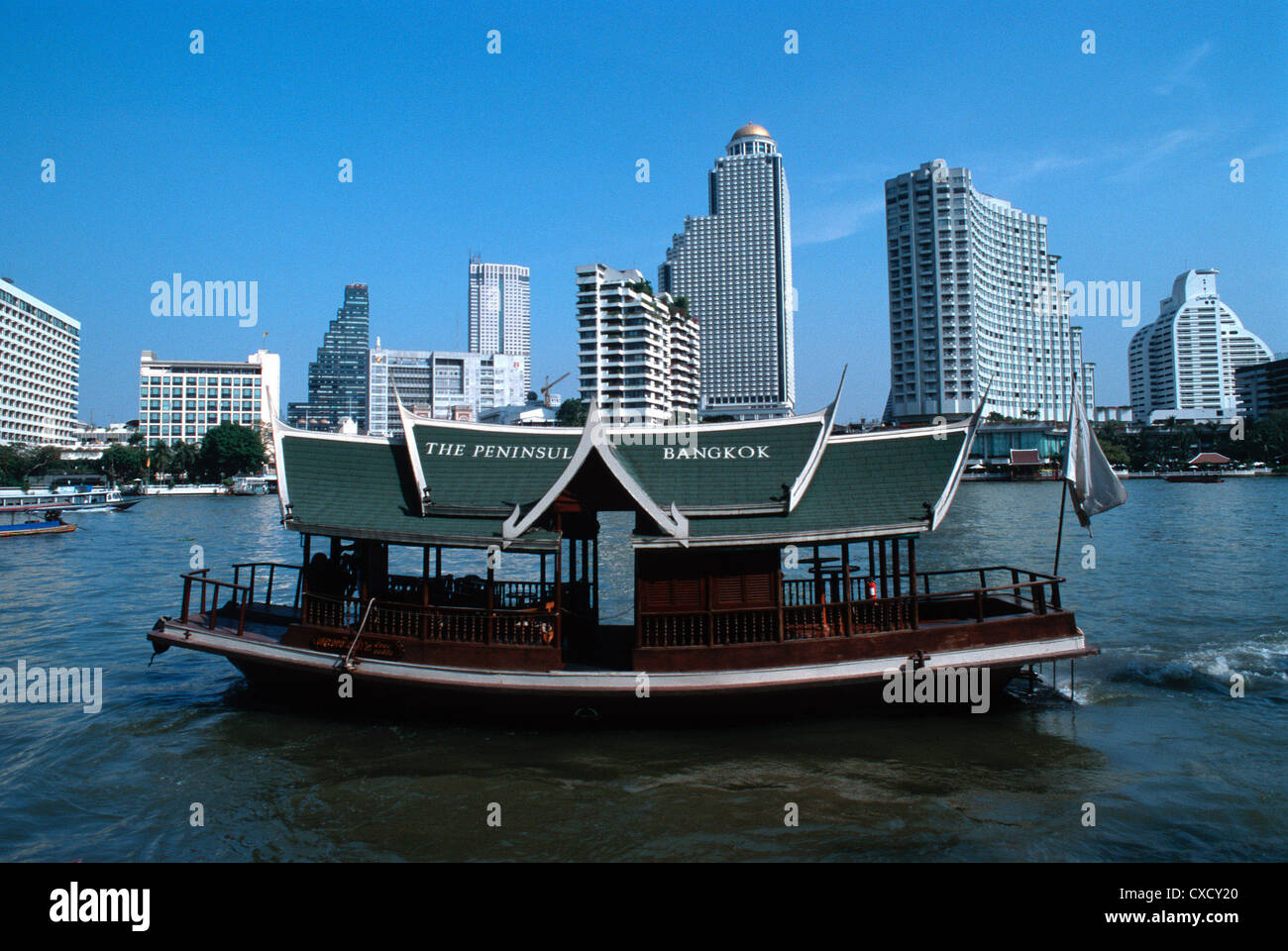Peninsula Hotelfaehre against the skyline of Bangkok Bangrak Stock Photo