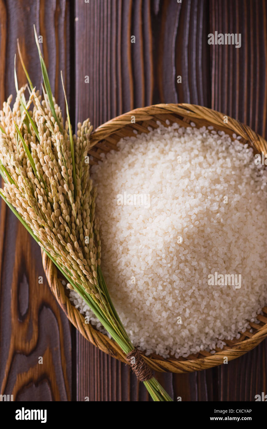 Rice Ear and Rice in Basket Stock Photo