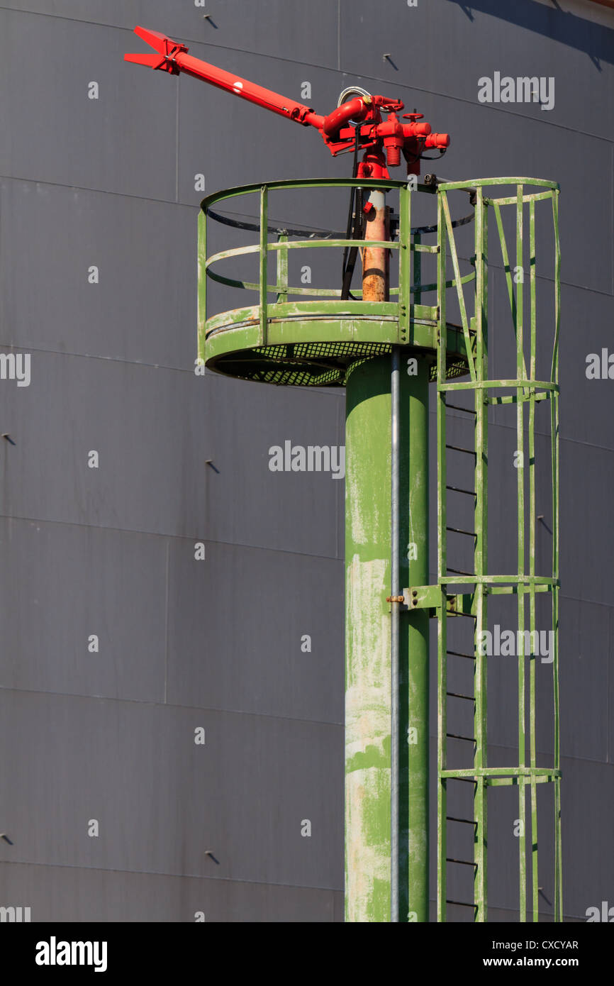 Fire Hose / Nozzle at an oil / gas heavy industry plant Stock Photo