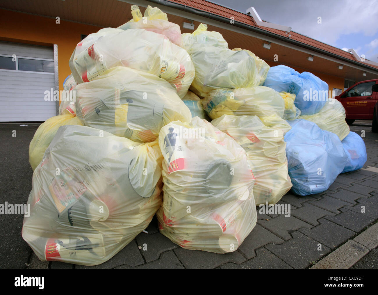Berlin stuffed, garbage bags in front of a McDonalds Stock Photo Alamy