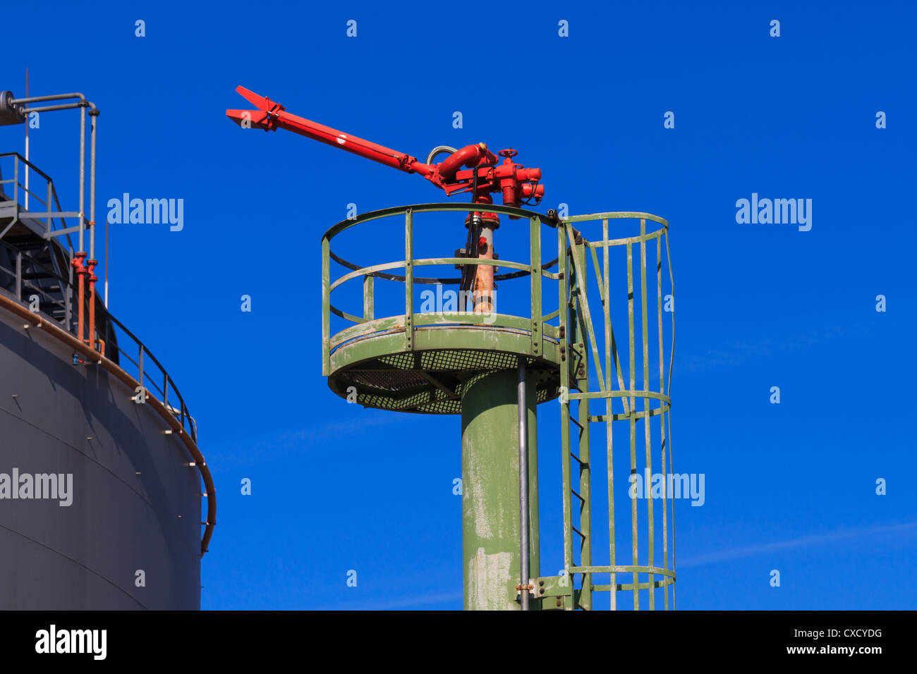 Fire Hose / Nozzle at an oil / gas heavy industry plant Stock Photo