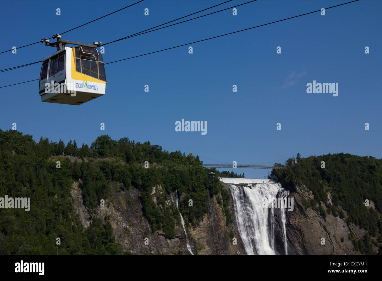 An aerial tram carries passengers between the base and the top of Montmorency Falls, Quebec City, Canada Stock Photo