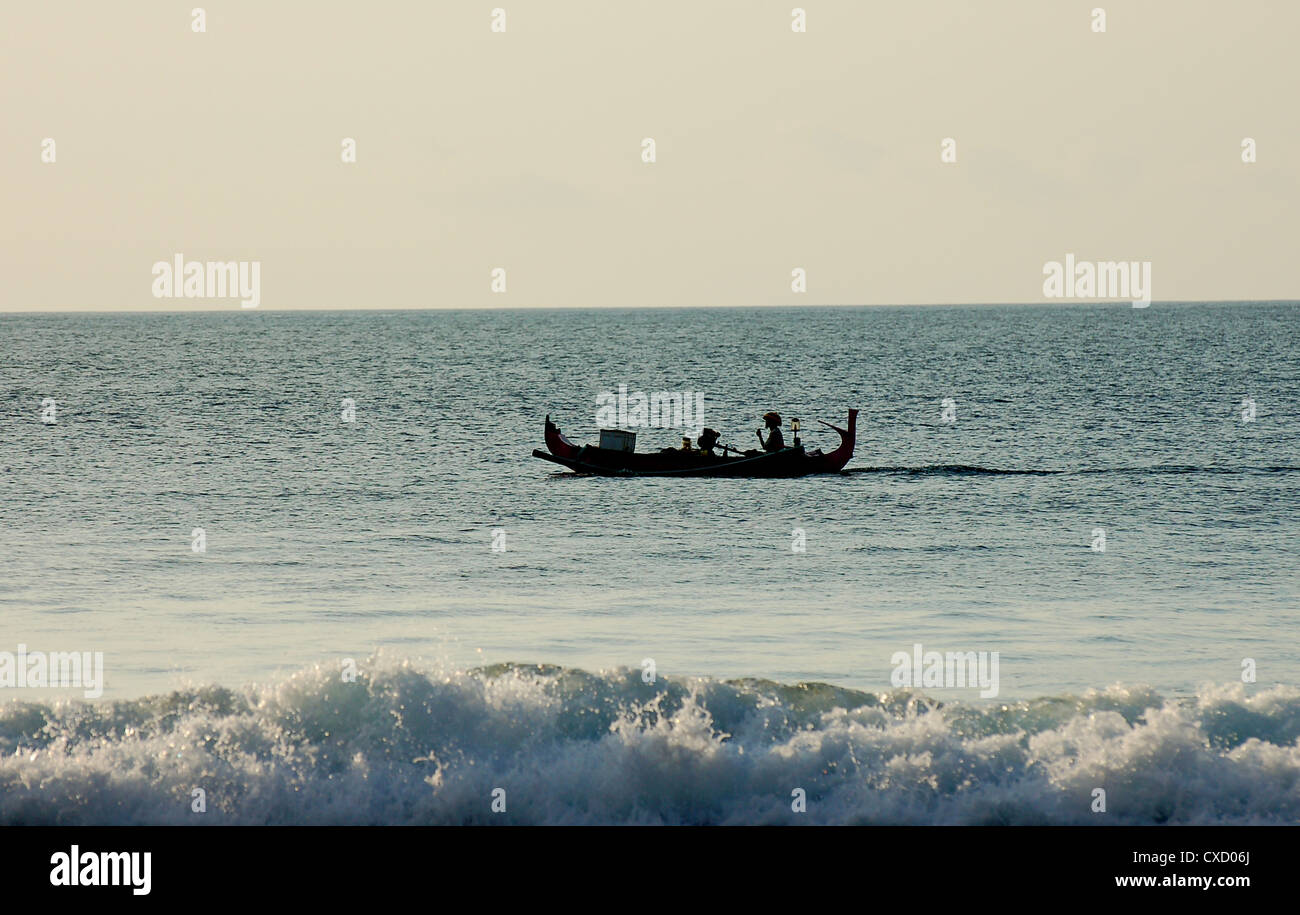 fishing boat in sunset Stock Photo - Alamy