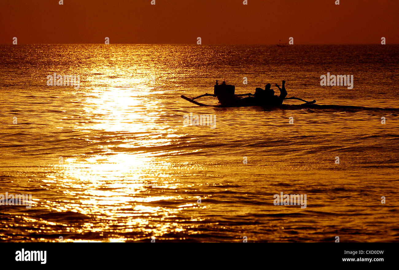fishing boat in sunset Stock Photo - Alamy