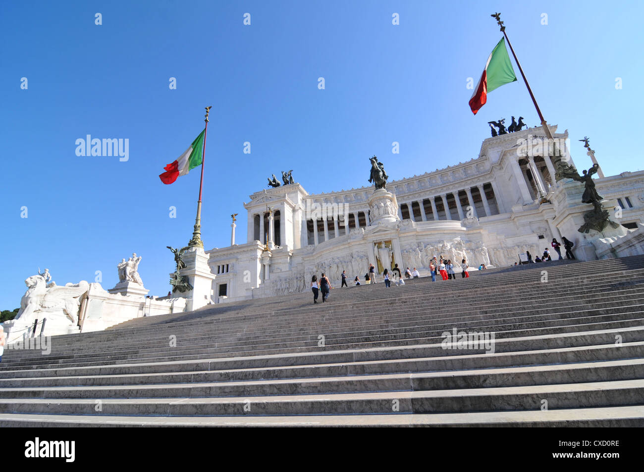 Rome, Italy - 30 March, 2012: Tourists visiting Piazza Venezia, major square and touristic attraction in central Rome Stock Photo