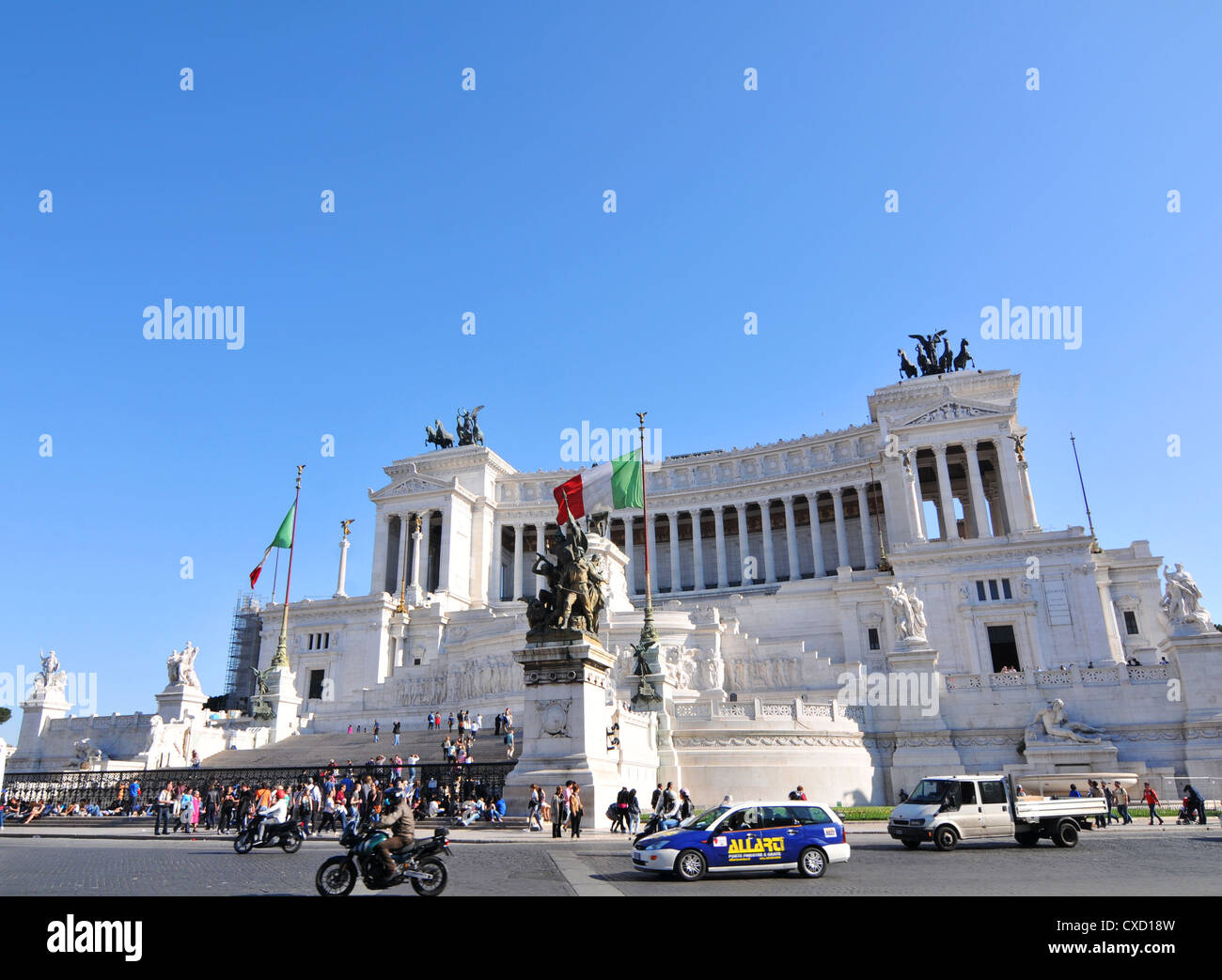 Rome, Italy - 30 March, 2012: Tourists visiting Piazza Venezia, major square and touristic attraction in central Rome Stock Photo