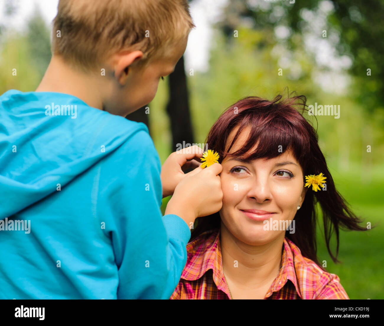 Mother and son play outside on field in the park Stock Photo - Alamy