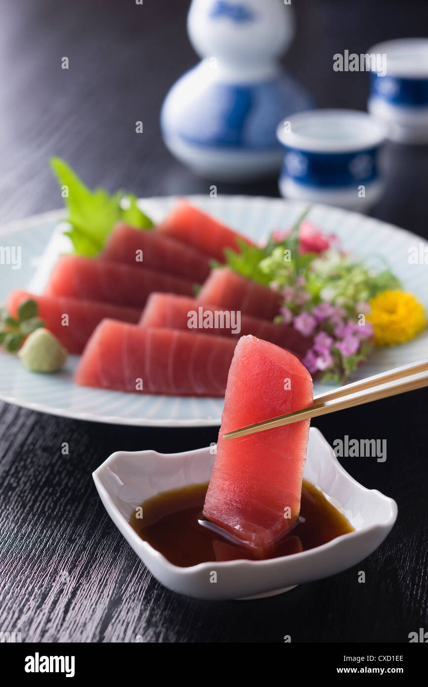 Lean Tuna Sashimi Dipped into Soy Sauce Stock Photo Alamy