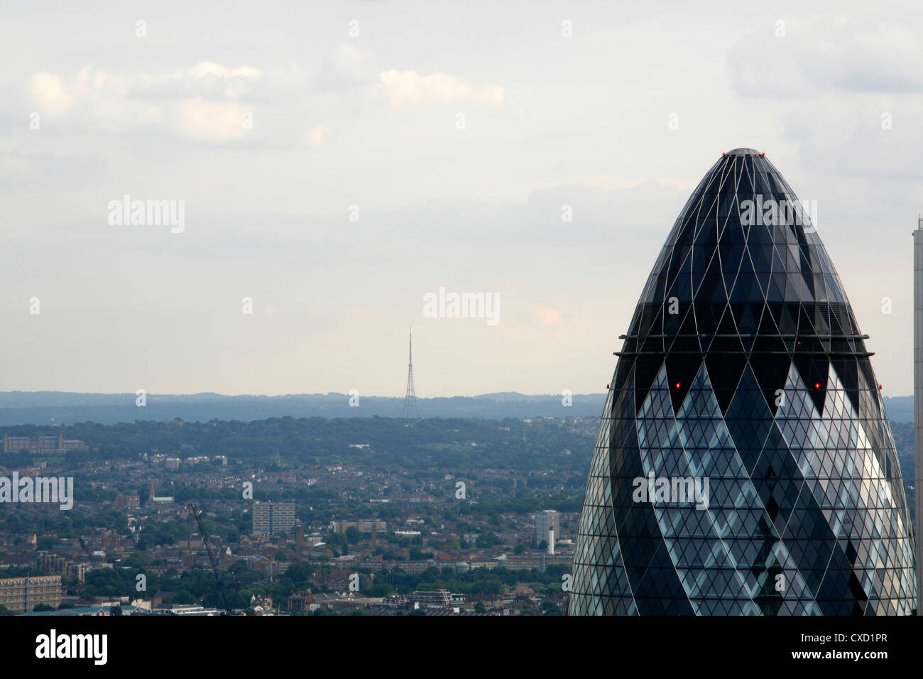 Skyline view of the top of the Gherkin and all the way across south London to the Crystal Palace TV transmitter mast, London, UK Stock Photo