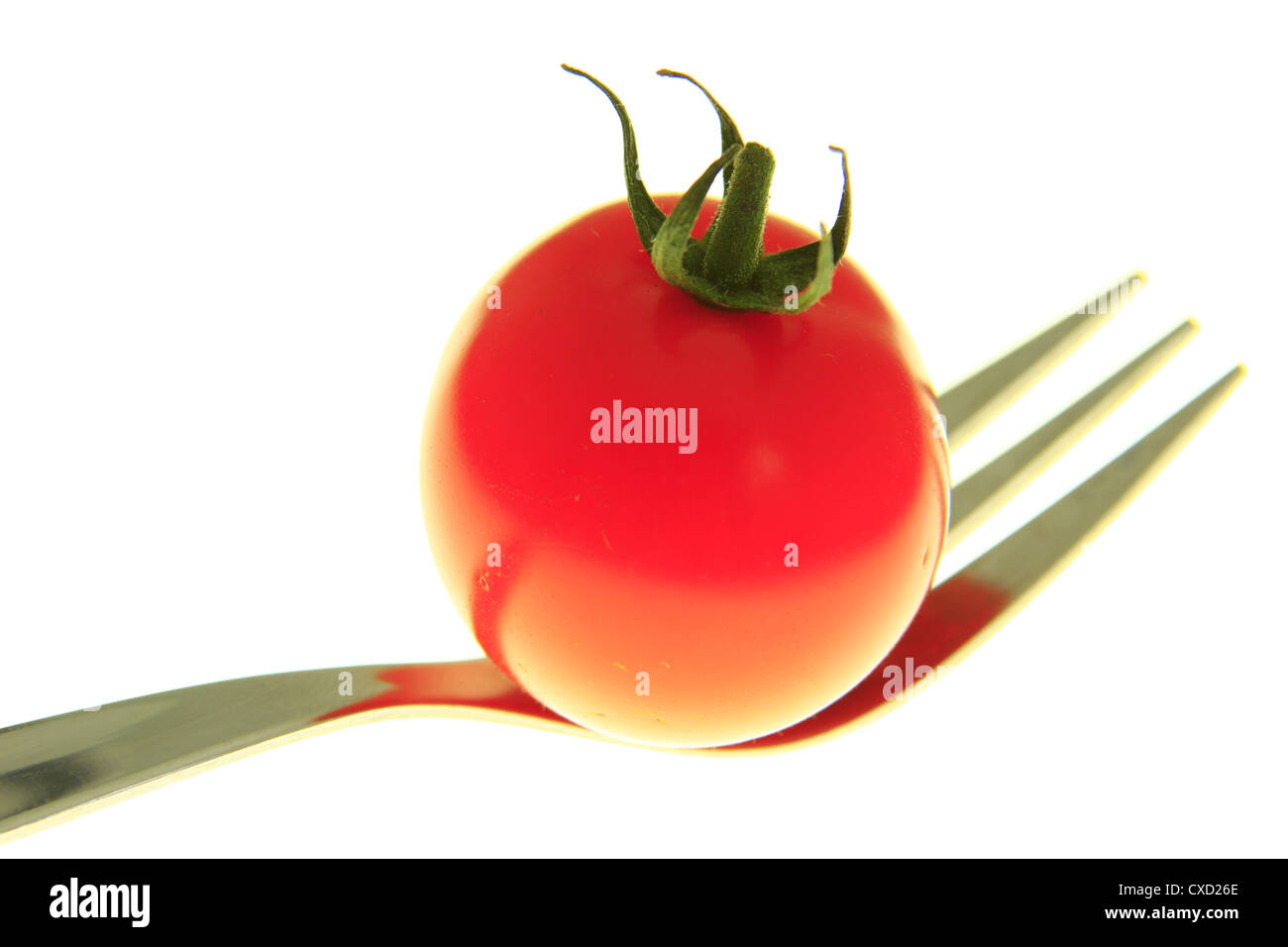 tomato on a fork Stock Photo