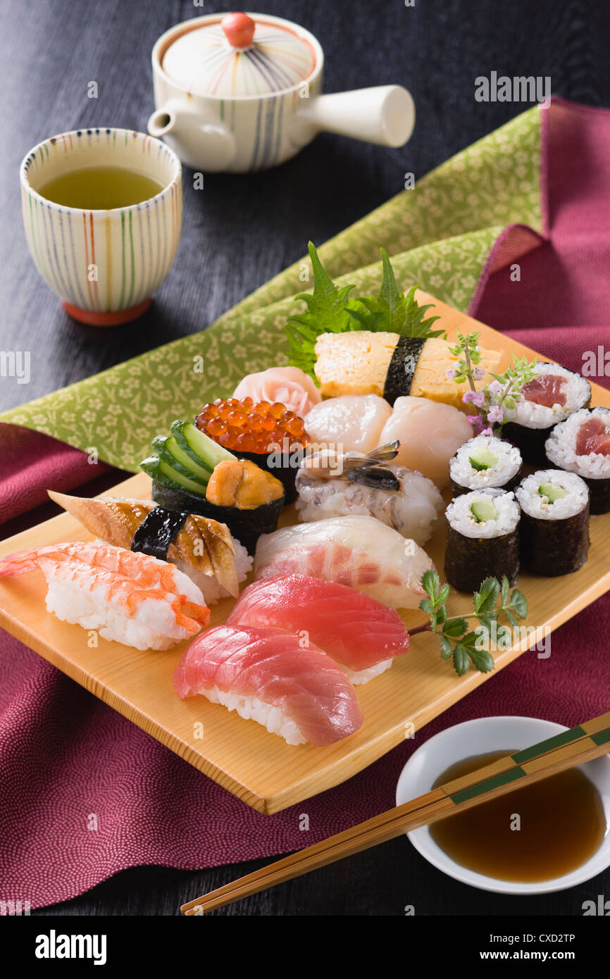 Assorted Sushi on Wooden Plate Stock Photo