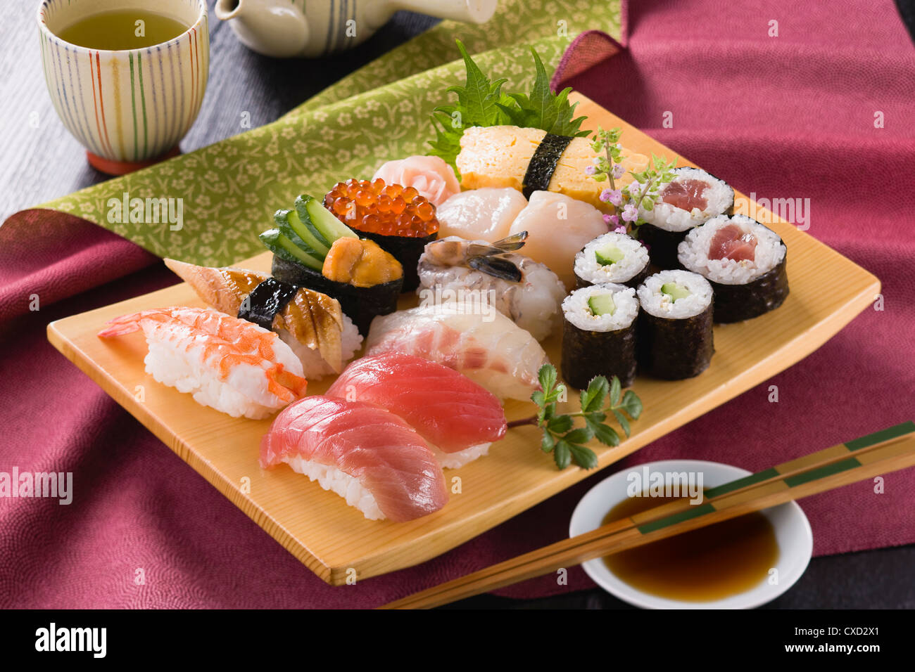 Assorted Sushi on Wooden Plate Stock Photo