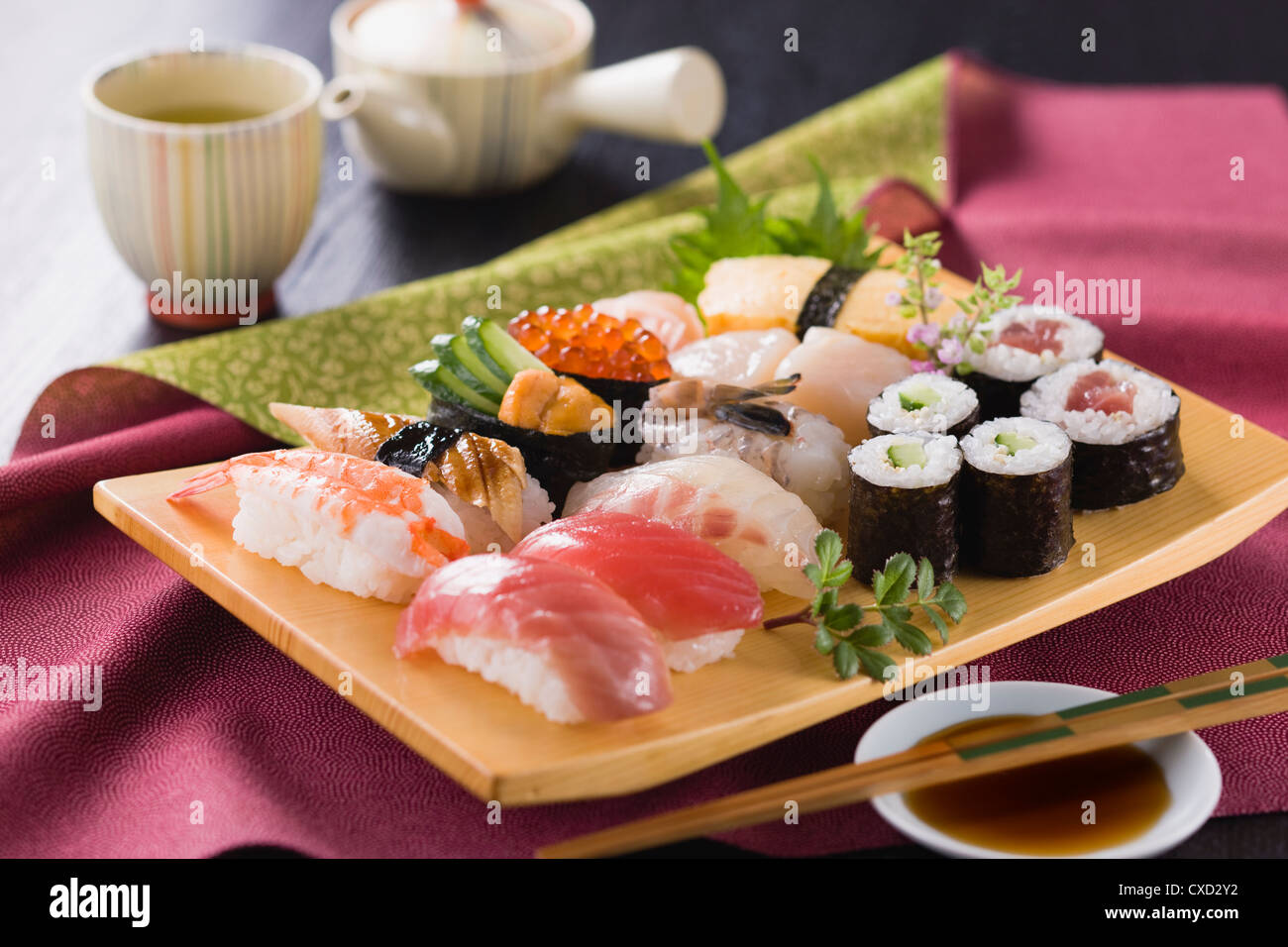 Assorted Sushi on Wooden Plate Stock Photo