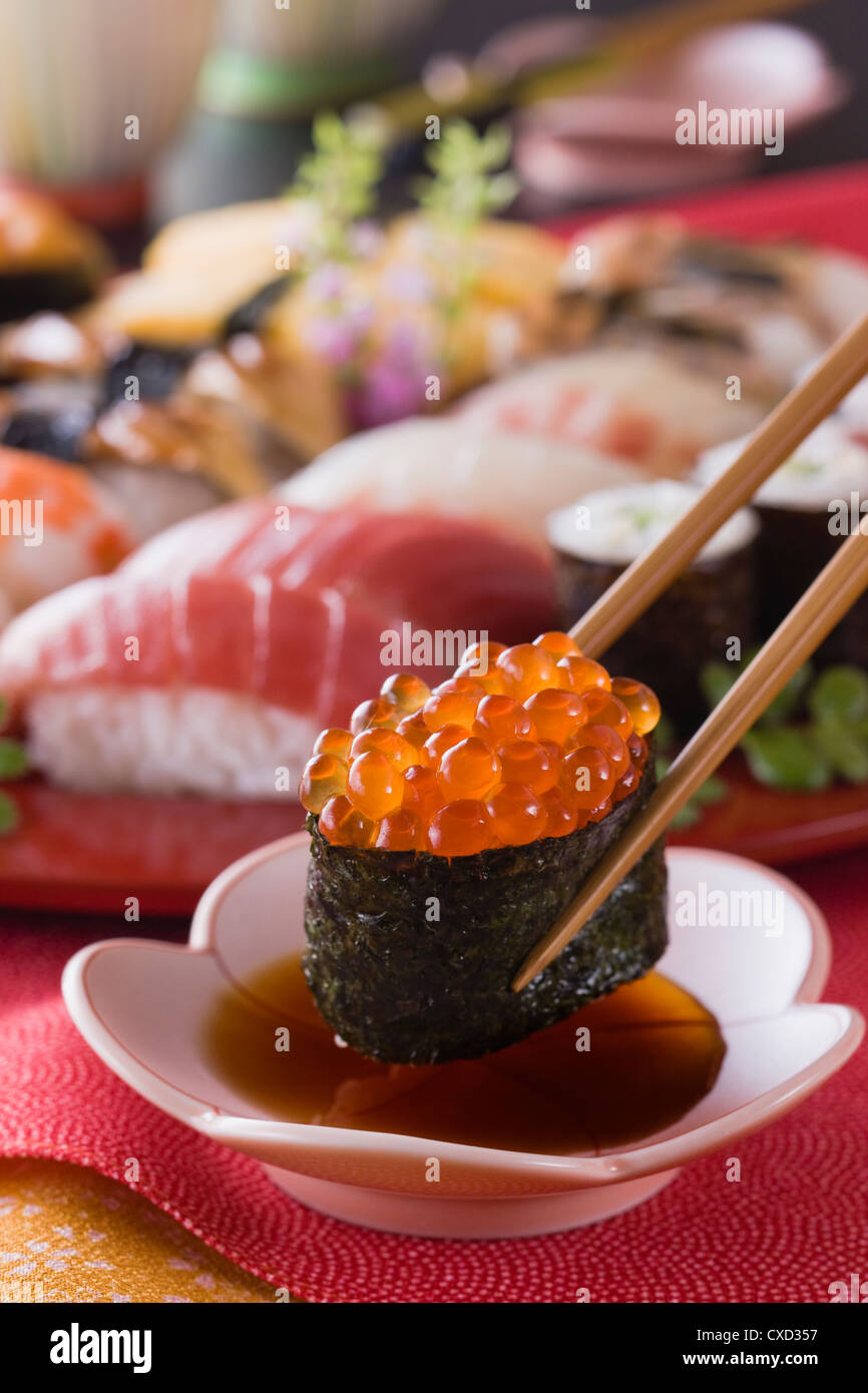 Salmon Roe Sushi Dipped into Soy Sauce Stock Photo Alamy