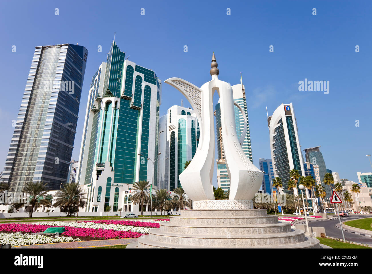 Coffee pot monument and the new skyline of the West Bay central financial district of Doha, Qatar, Middle East Stock Photo