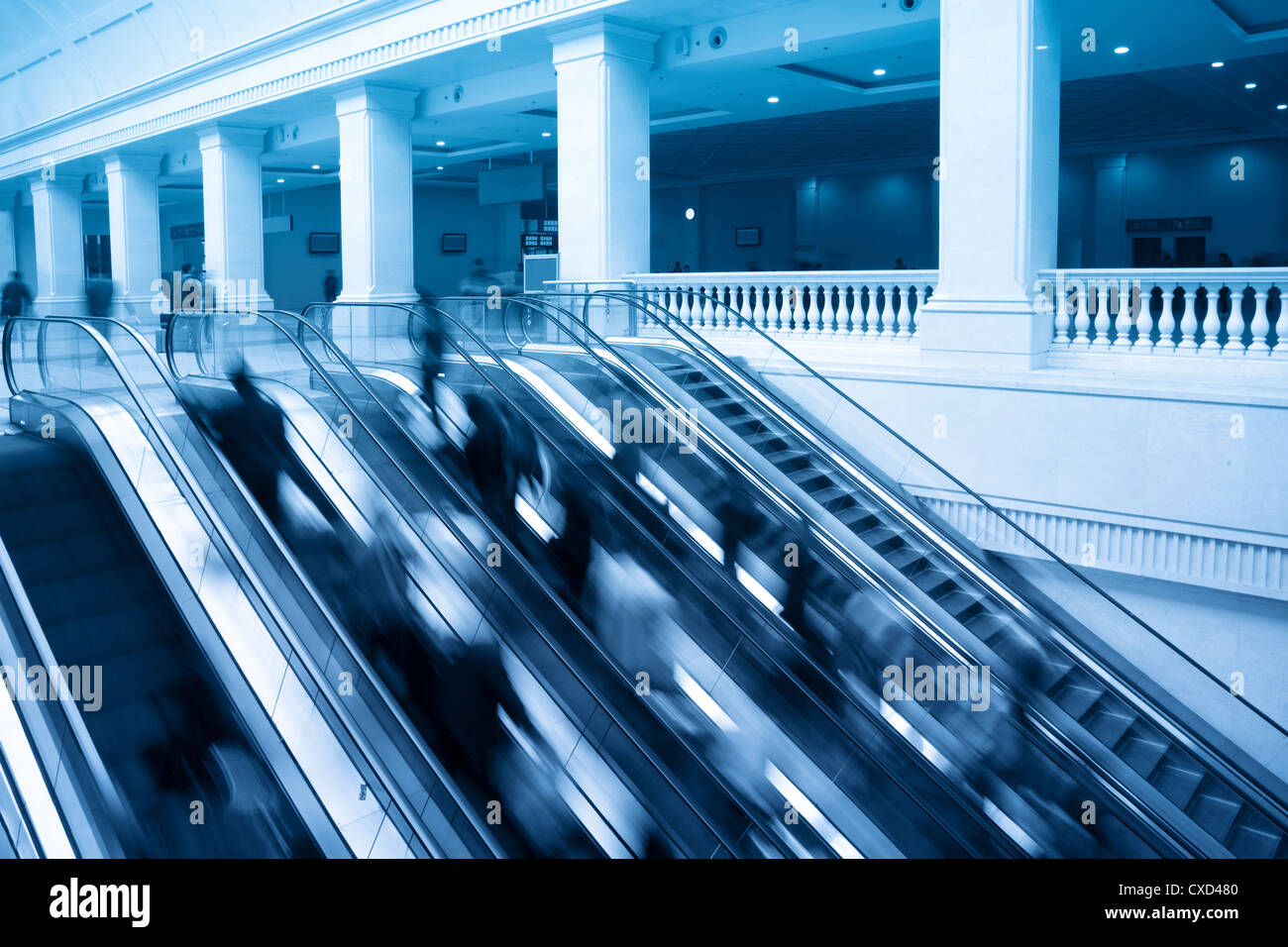 escalators with passenger motion blur Stock Photo