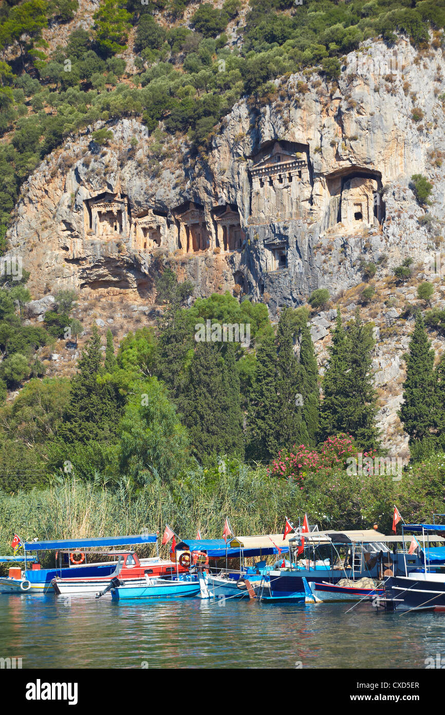 Lycian tombs of Dalyan with fishing and tourists boats below, Dalyan, Anatolia, Turkey, Asia Minor, Eurasia Stock Photo