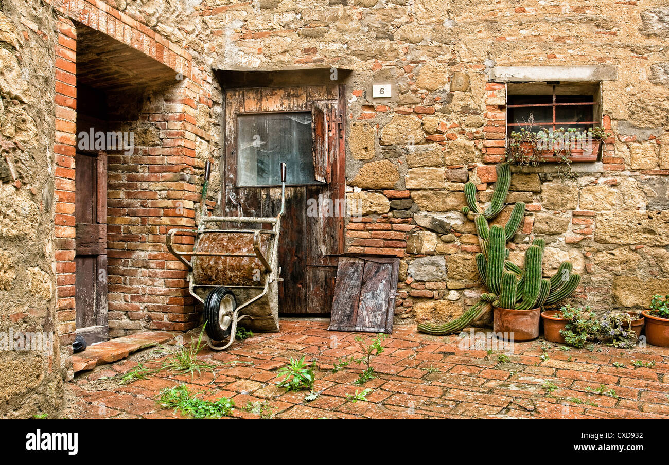 The old brick house with cacti and truck Stock Photo