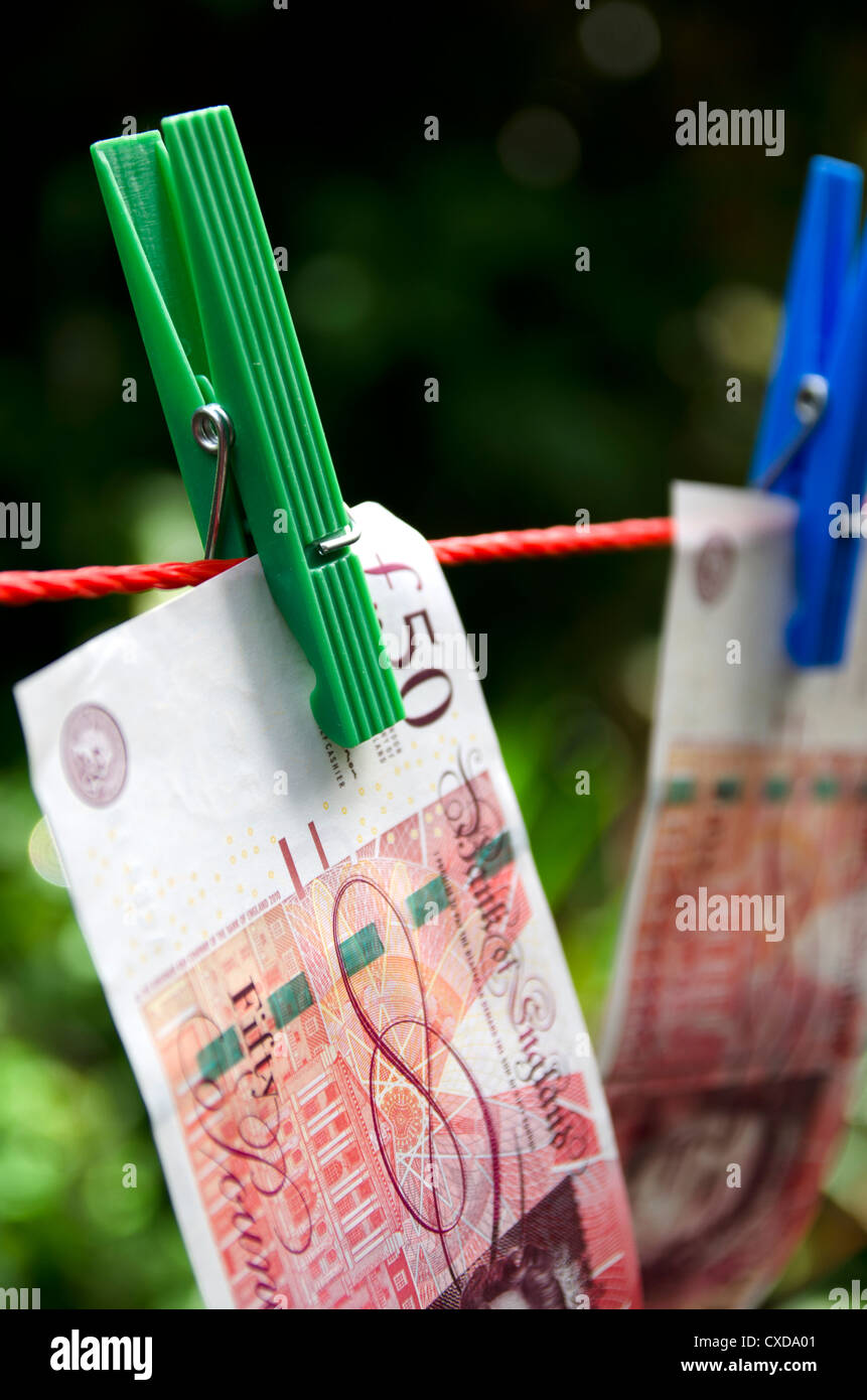 Washing Line Notes British pound notes on washing line in garden Stock Photo - Alamy