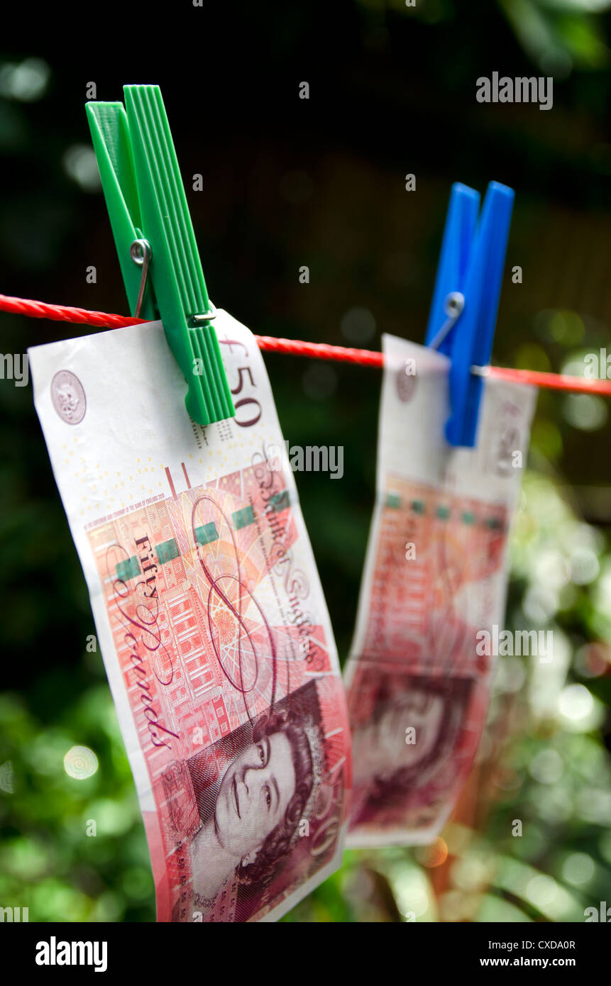 Washing Line Notes British pound notes on washing line in garden Stock Photo - Alamy