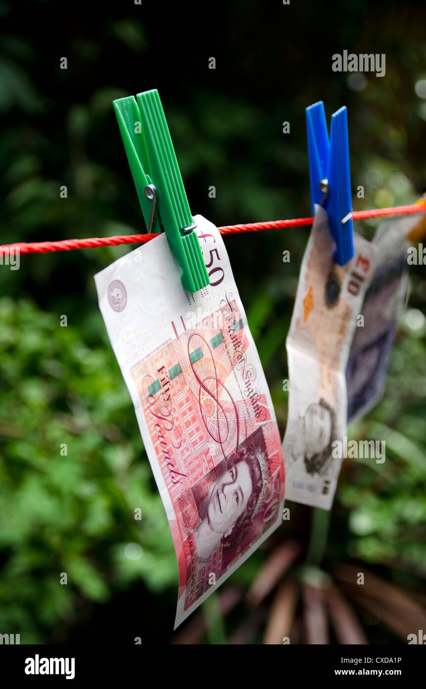Washing Line Notes British pound notes on washing line in garden Stock Photo - Alamy