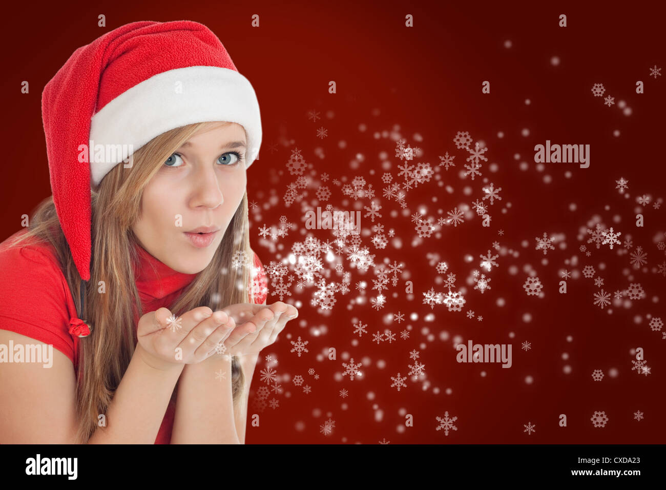 Photo of Christmas girl blowing wishes Stock Photo
