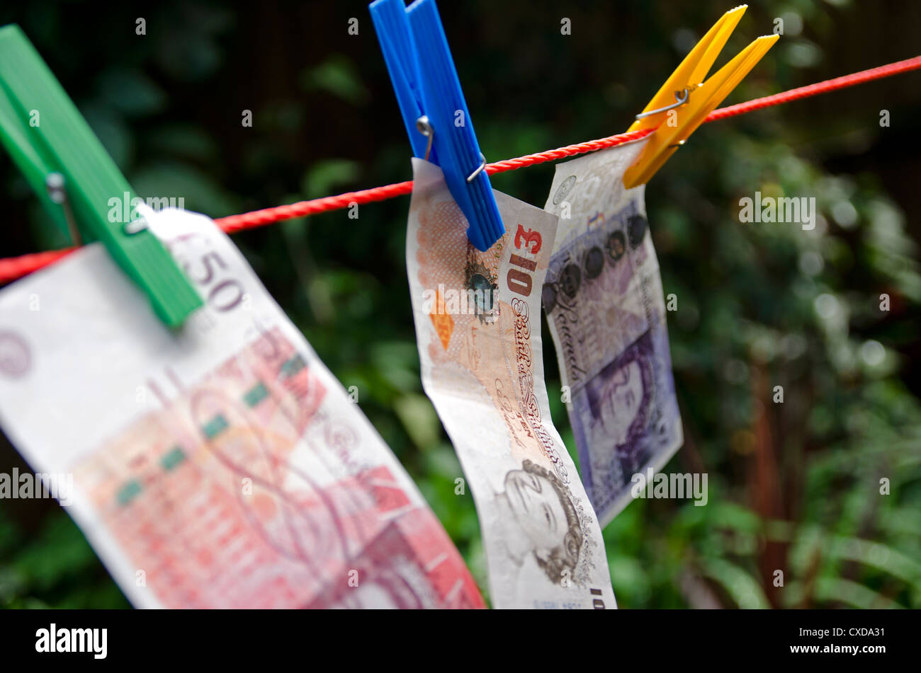 Washing Line Notes British pound notes on washing line in garden Stock Photo - Alamy