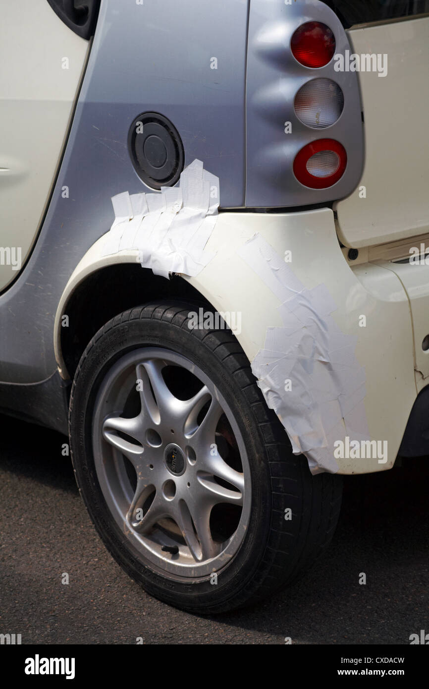 Smart car with tape over wheel arch following damage Stock Photo Alamy