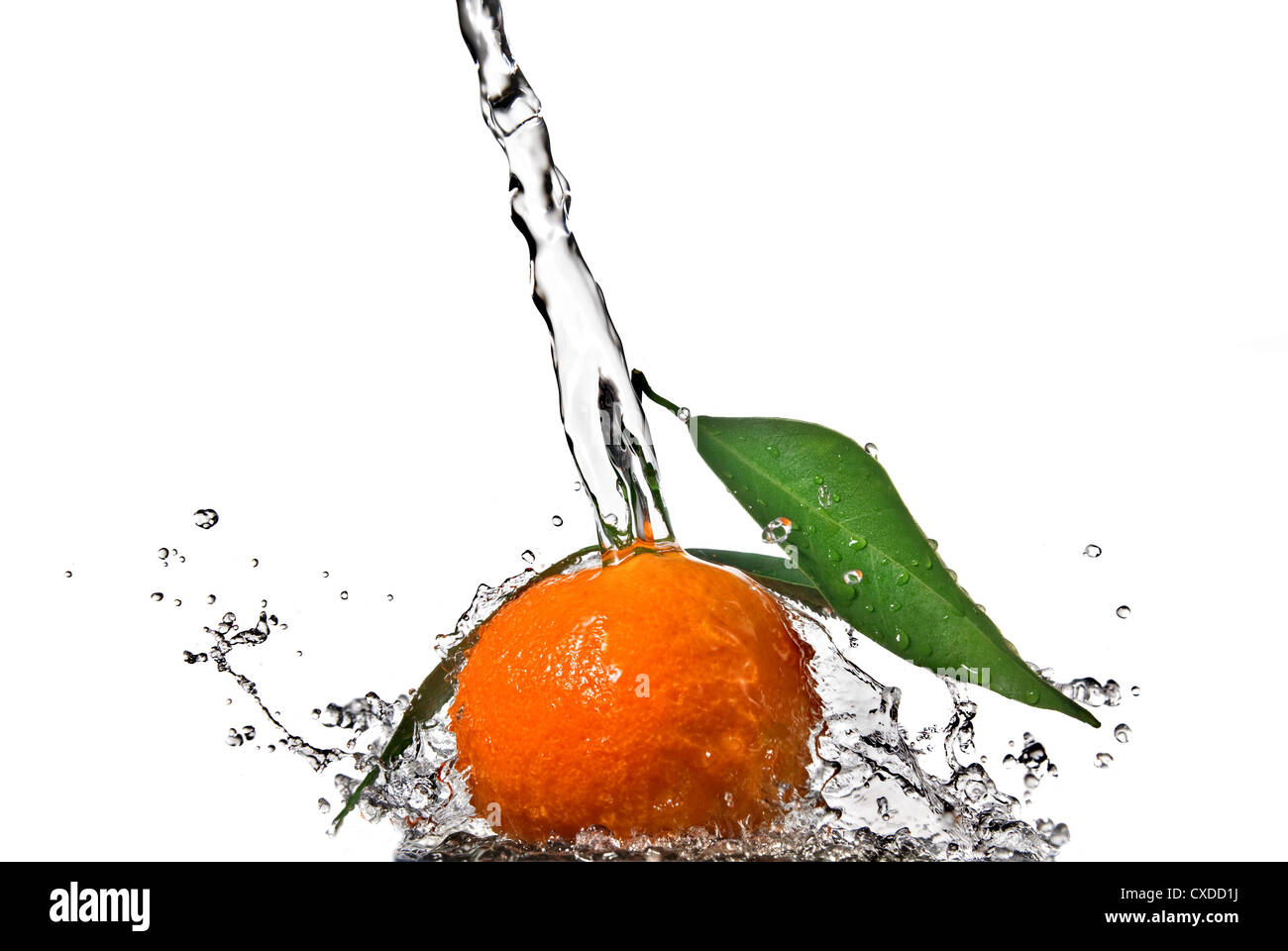 Tangerine with green leaves and water splash isolated on white Stock