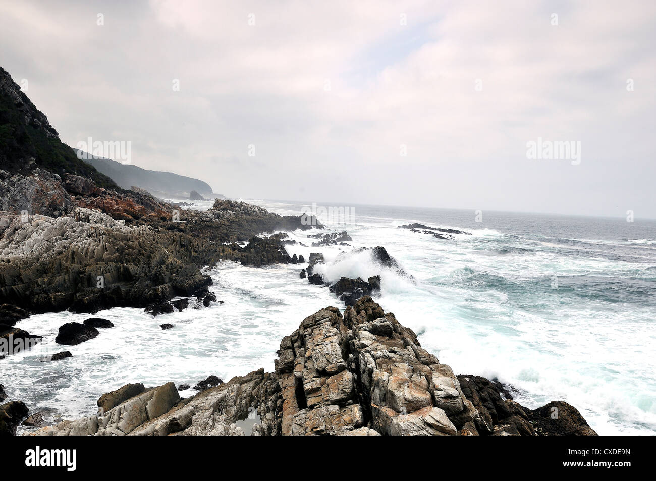 Waves Breaking on Rocks Stock Photo - Alamy