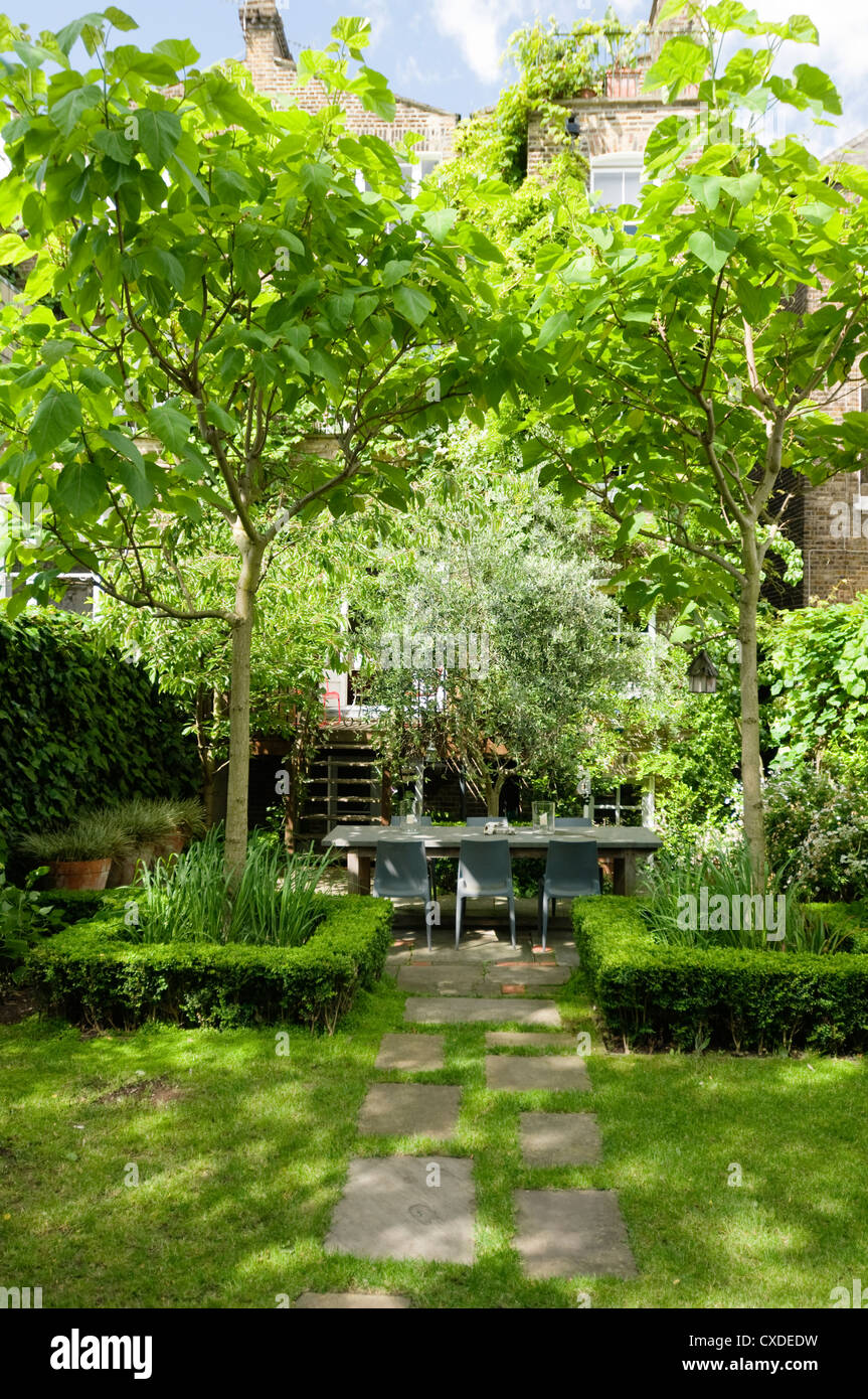 Symmetrical garden planting in London townhouse exterior Stock Photo