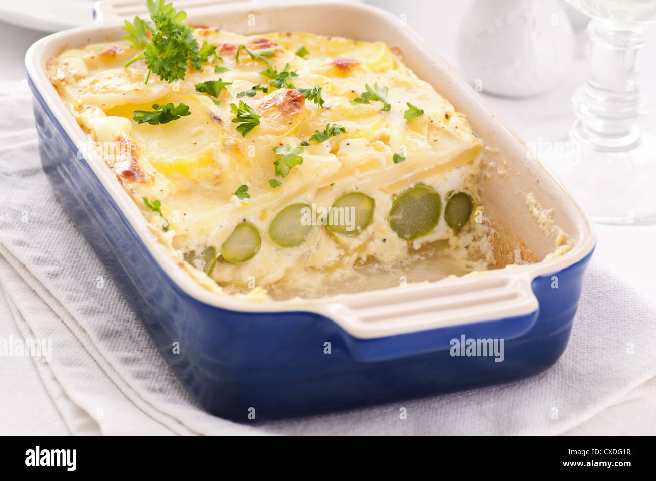 Potato gratin with green asparagus Stock Photo Alamy