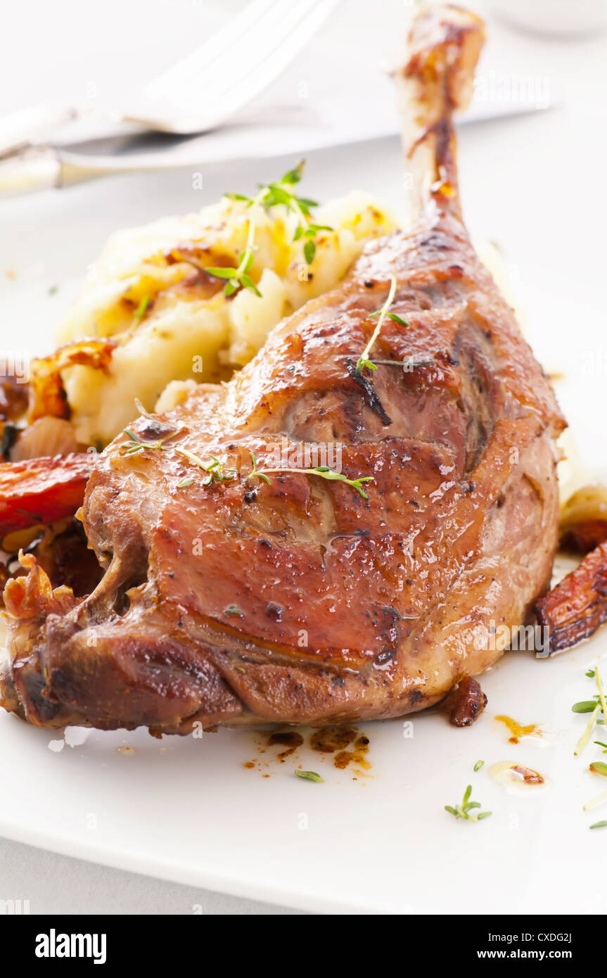 duck leg roasted with herbs Stock Photo