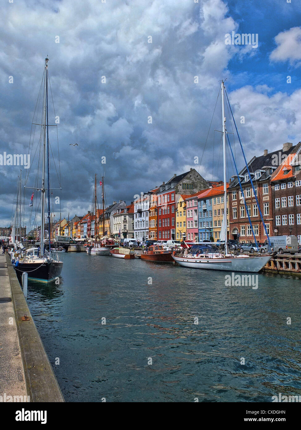Boats and historic waterfront buildings, Nyhavn, Copenhagen, Denmark Stock Photo